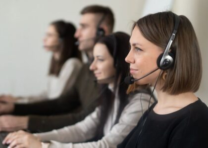 Intake coordinator taking a call with a headset