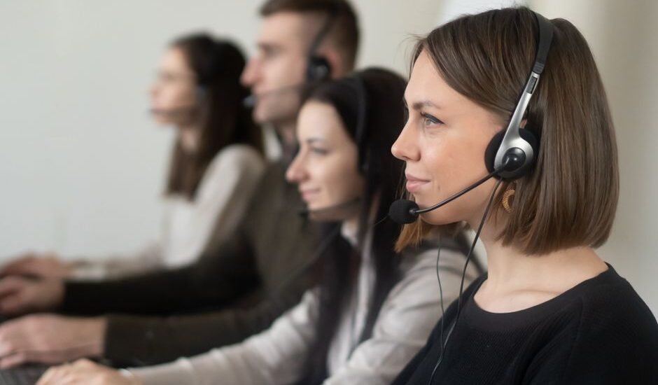 Intake coordinator taking a call with a headset
