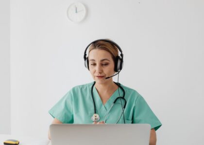 Physician reviewing a practice website on a laptop