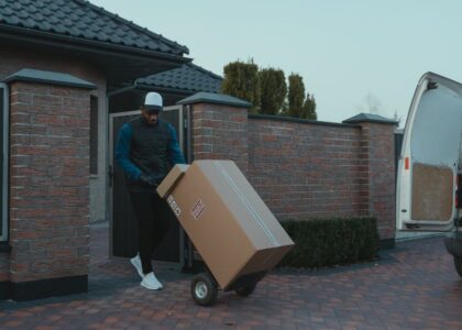Movers loading boxes into a moving truck