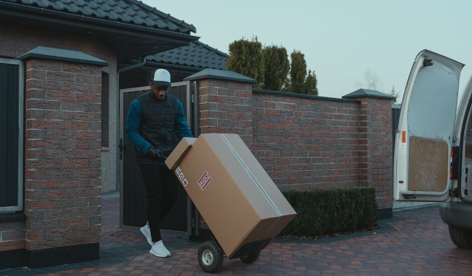 Movers loading boxes into a moving truck